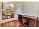 This well-lit office has wood floors and provides a view into the living room at 5750 Saddle Oak Trl, Sarasota, FL 34241