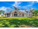 Screened-in pool view from the backyard, perfect for outdoor relaxation and entertainment at 5750 Saddle Oak Trl, Sarasota, FL 34241