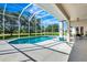 A serene screened-in pool with a view of the backyard at 5750 Saddle Oak Trl, Sarasota, FL 34241