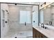 Modern bathroom featuring tiled shower, and marble countertop at 6832 Bay Hill Dr, Lakewood Ranch, FL 34202