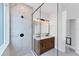 Modern bathroom featuring glass shower, marble tile, and dark fixtures at 6832 Bay Hill Dr, Lakewood Ranch, FL 34202