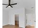 Bedroom featuring a ceiling fan, wood-look floors, and closet at 6832 Bay Hill Dr, Lakewood Ranch, FL 34202