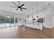 Open-concept kitchen with a large island, stainless steel appliances, and access to the lanai and pool area at 6832 Bay Hill Dr, Lakewood Ranch, FL 34202