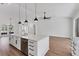 Spacious kitchen island with stainless steel appliances, modern pendant lighting, and plenty of storage at 6832 Bay Hill Dr, Lakewood Ranch, FL 34202