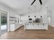 Bright, updated kitchen featuring an island with seating, modern appliances, and views of the pool at 6832 Bay Hill Dr, Lakewood Ranch, FL 34202