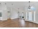 Bright and spacious living room featuring high ceilings, hardwood floors, modern lighting, and large windows at 6832 Bay Hill Dr, Lakewood Ranch, FL 34202