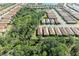 Expansive aerial view showcasing a well-developed community with beautiful homes and a scenic green area at 701 Maraviya Blvd, Nokomis, FL 34275