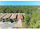 A picturesque aerial view of the neighborhood, showcasing lush greenery and well-maintained properties at 701 Maraviya Blvd, Nokomis, FL 34275