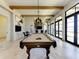 Recreation room featuring pool table, bar, and multiple TVs, perfect for entertainment and socializing at 701 Maraviya Blvd, Nokomis, FL 34275