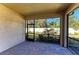 Screened lanai with brick floor, offering views of the landscaped backyard with mature trees and privacy fence at 701 Maraviya Blvd, Nokomis, FL 34275