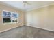 Neutral bedroom with gray carpet, a ceiling fan, neutral paint, and a window with blinds at 7108 Playa Bella Dr, Bradenton, FL 34209