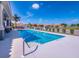 Community pool is surrounded by white fencing and offers space to relax in the Florida sun at 7108 Playa Bella Dr, Bradenton, FL 34209