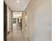 Inviting hallway with tile flooring, leading to the home's living spaces at 7108 Playa Bella Dr, Bradenton, FL 34209