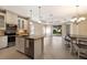 Open-concept kitchen featuring an island, granite countertops, and ample storage at 7108 Playa Bella Dr, Bradenton, FL 34209