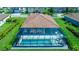 Aerial view of the home with screened in pool and lush green lawn at 7323 Great Egret Blvd, Sarasota, FL 34241