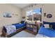 Shared bedroom featuring two beds, bright window and themed decor at 7323 Great Egret Blvd, Sarasota, FL 34241
