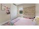 Comfortable bedroom featuring a closet and window with flower decorations at 7323 Great Egret Blvd, Sarasota, FL 34241