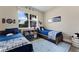 Shared bedroom featuring two beds, bright window and nautical themed decor at 7323 Great Egret Blvd, Sarasota, FL 34241