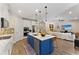 Modern kitchen with a center island, stainless steel appliances and an adjacent living area for easy entertaining at 7323 Great Egret Blvd, Sarasota, FL 34241
