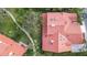 Stunning aerial view showcasing the red tile roof and landscaping of this beautiful single-Gathering home at 7344 Villa D Este Dr, Sarasota, FL 34238