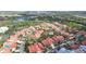 Panoramic aerial view of the community, showcasing the lush landscape and nearby golf course at 7344 Villa D Este Dr, Sarasota, FL 34238