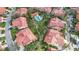 A beautiful neighborhood with a shared pool and well-manicured landscaping is seen from the air at 7344 Villa D Este Dr, Sarasota, FL 34238