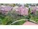 Aerial view of a residential neighborhood with lush greenery, well-maintained lawns, and attractive homes at 7344 Villa D Este Dr, Sarasota, FL 34238