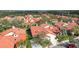 Aerial view of a lovely neighborhood displaying tile roofs, mature landscaping, and inviting curb appeal at 7344 Villa D Este Dr, Sarasota, FL 34238