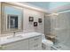Stylish bathroom with a glass-enclosed shower, vanity with modern fixtures and mirror at 7344 Villa D Este Dr, Sarasota, FL 34238