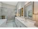 Elegant bathroom featuring walk-in shower, and double vanity with ample counter space at 7344 Villa D Este Dr, Sarasota, FL 34238