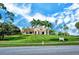A large, well-maintained building on a grassy hill hosts the clubhouse and surrounding golf course at 7344 Villa D Este Dr, Sarasota, FL 34238