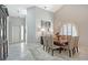 Bright dining room with high ceilings, a large window, and an elegant light fixture at 7344 Villa D Este Dr, Sarasota, FL 34238