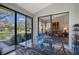 Bright dining area with seating for six, glass-top table, and views of the garden at 7344 Villa D Este Dr, Sarasota, FL 34238