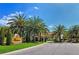 The Residences entrance is marked by lush landscaping and decorative monuments in this photo at 7344 Villa D Este Dr, Sarasota, FL 34238