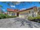 Charming single Gathering home featuring a barrel tile roof and an attached two car garage at 7344 Villa D Este Dr, Sarasota, FL 34238