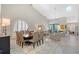 Bright and airy living room featuring high ceilings, tile floors, and a formal dining area at 7344 Villa D Este Dr, Sarasota, FL 34238