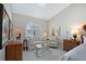 Sitting area in a spacious main bedroom with a skylight, and stylish decor at 7344 Villa D Este Dr, Sarasota, FL 34238