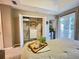 Bedroom featuring a king bed, closet, and access to a balcony at 8811 White Sage Loop # 8811, Lakewood Ranch, FL 34202