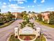 Inviting entrance to the Willowbrook community with lush landscaping and a secure gate at 8811 White Sage Loop # 8811, Lakewood Ranch, FL 34202
