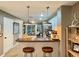 Modern kitchen with breakfast bar, stainless steel appliances, and pendant lighting at 8811 White Sage Loop # 8811, Lakewood Ranch, FL 34202
