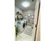 Well-lit laundry room has updated appliances and decor at 8811 White Sage Loop # 8811, Lakewood Ranch, FL 34202