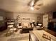 Retro-inspired living room with eclectic décor, cozy seating, and a unique lounge vibe at 8811 White Sage Loop # 8811, Lakewood Ranch, FL 34202
