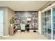 Well-lit home office with motivational wall art, a sleek desk, and sliding glass doors at 8811 White Sage Loop # 8811, Lakewood Ranch, FL 34202