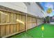 Backyard with putting green and wooden fence at 214 S Westland Ave # 1, Tampa, FL 33606