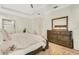 Bright bedroom with a large bed, dresser, and mirror at 214 S Westland Ave # 1, Tampa, FL 33606