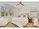 Bright bedroom with a queen-size bed, light walls, and wooden nightstand at 214 S Westland Ave # 1, Tampa, FL 33606