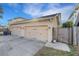 Three-car garage with light beige doors at 214 S Westland Ave # 1, Tampa, FL 33606