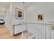 Upstairs hallway with white walls, light wood floors, and a modern console table at 214 S Westland Ave # 1, Tampa, FL 33606