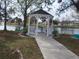 White gazebo overlooking a pond with benches at 6337 Fantasy Ct, North Port, FL 34287