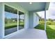 Covered patio with sliding glass doors leading to backyard at 9245 Zorn St, Port Charlotte, FL 33981